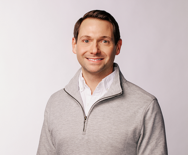 Headshot of Aaron Rankin, Chief Technology Officer, wearing a grey long-sleeved shirt.​​ 